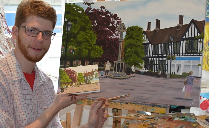 artist Christian Turner with his oil painting and card of Nantwich Town Square
