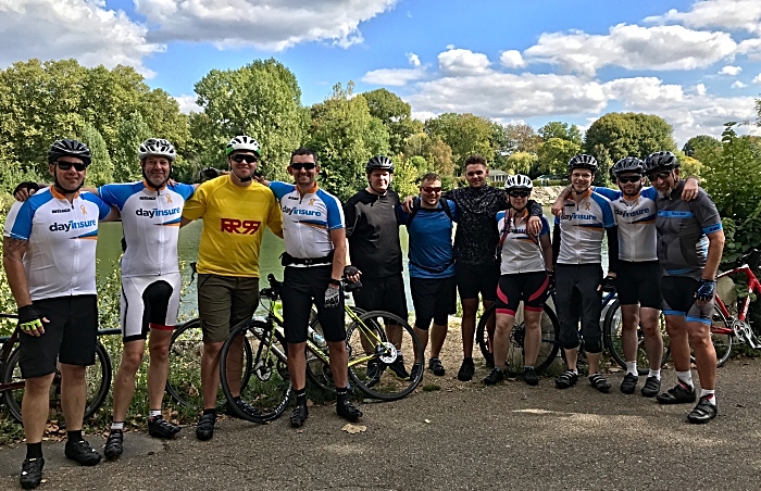 Cyclists rest alongside the Seine River 25 miles from Paris (1)