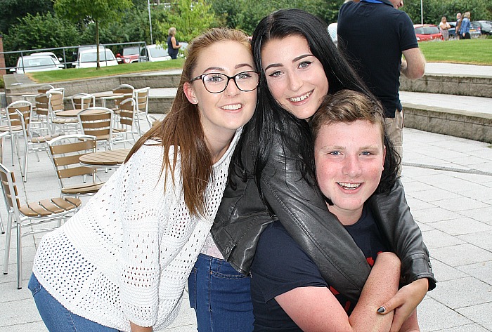 Emily Young and Gemma Read give Calum Parry a hug and pat on the back