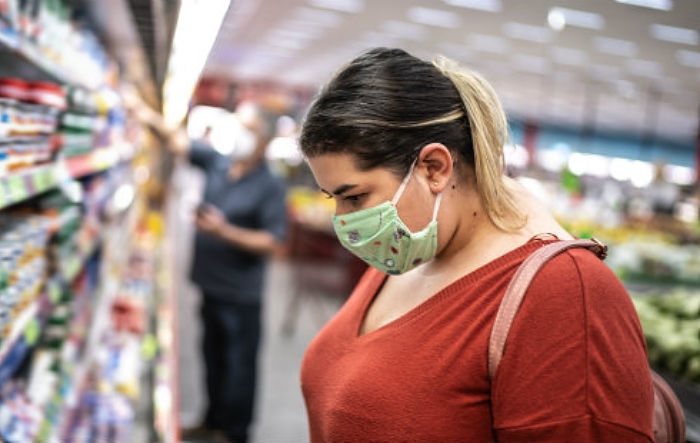 Female shopper wearing a face covering