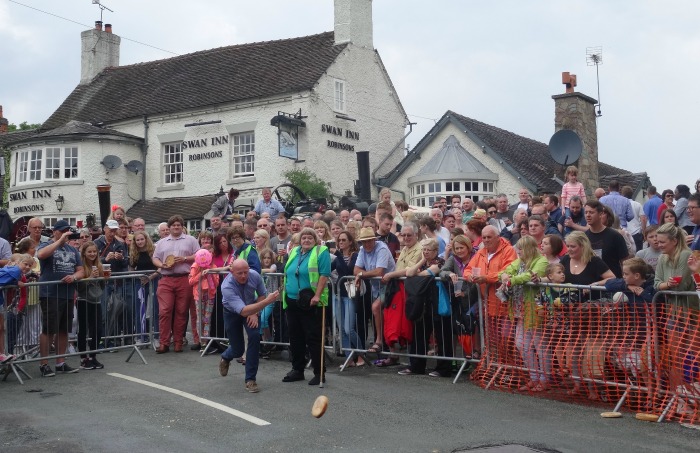 Fig Pie Wake- A competitor in the Adult race rolls outside the Swan   Inn