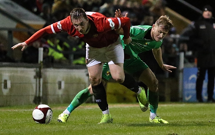 First-half - David Webb challenges for the ball (1)