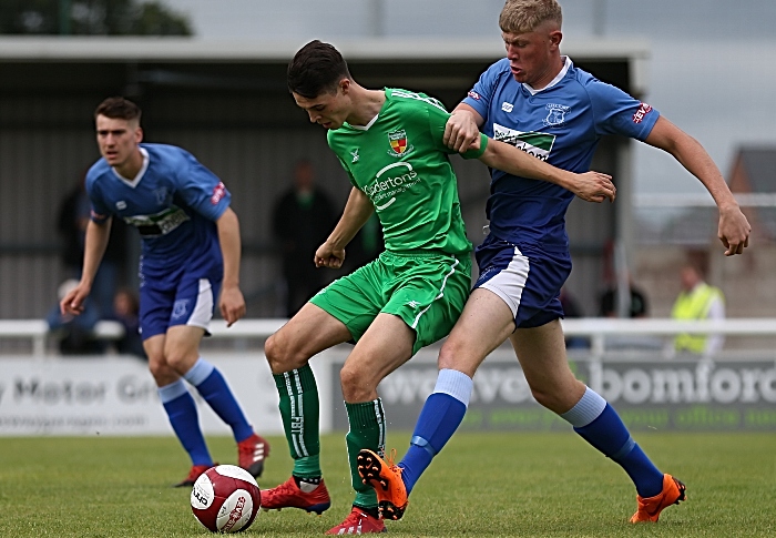 First-half - Joe Malkin on the ball under pressure from Leek Town (1)