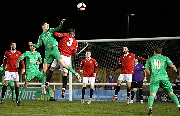 First-half - Joe Malkin wins a header under pressure from FCUM (1)