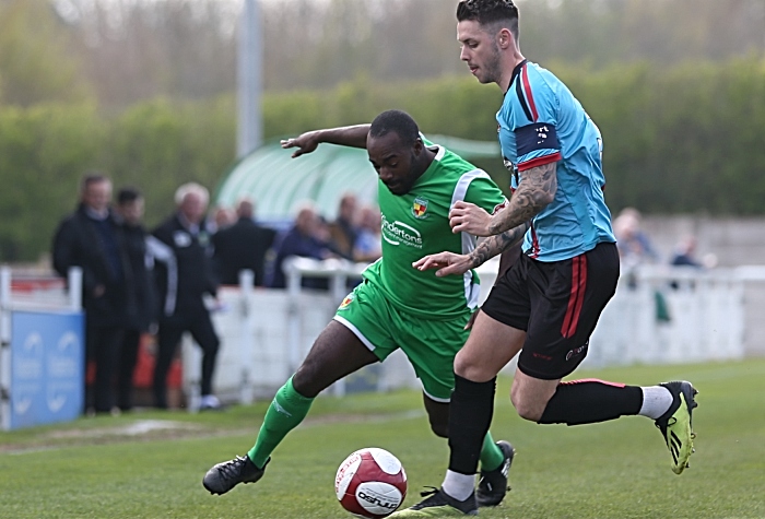 First-half - Joe Mwasile fights for the ball (1)