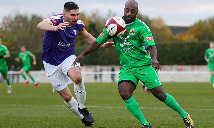 First-half - Joe Mwasile in the ball under pressure from Grantham captain James Williamson (1)