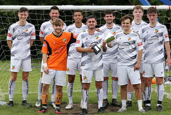 Full-time - All Stars v Nantwich Town FC captain Caspar Hughes (centre) with trophy and team (1)