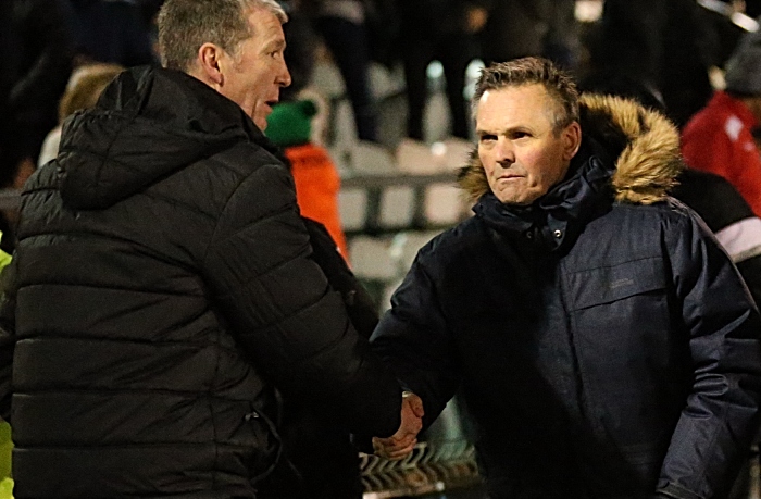 Full-time - Nantwich Town Manager Dave Cooke shakes hands with Stockport County Manager Jim Gannon (1)