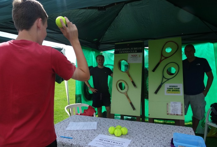 George Raiswell aims a ball on the Wistaston Jubilee Tennis Club stall