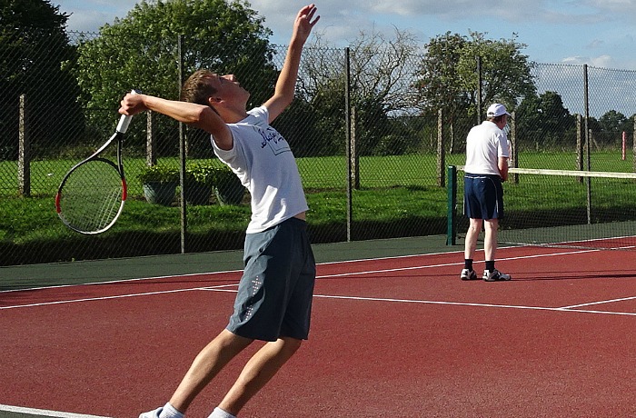 george-raiswell-serves-to-roy-broughton-during-the-mens-doubles-final
