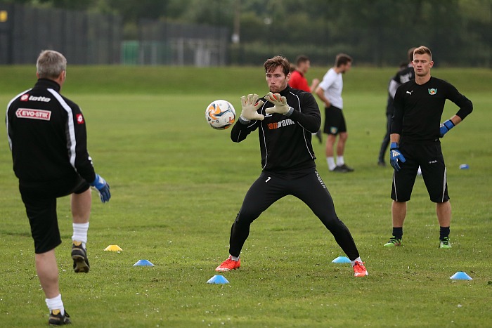 Training - Goalkeeper Fabian Spiess saves the ball from goalkeeping coach Paddy