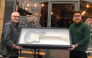 Beerdock boss raises £3,500 with The Buzzcocks guitar raffle