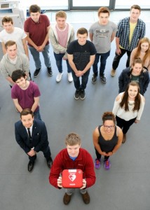 Harrison Lunt and Brine Leas students with defib