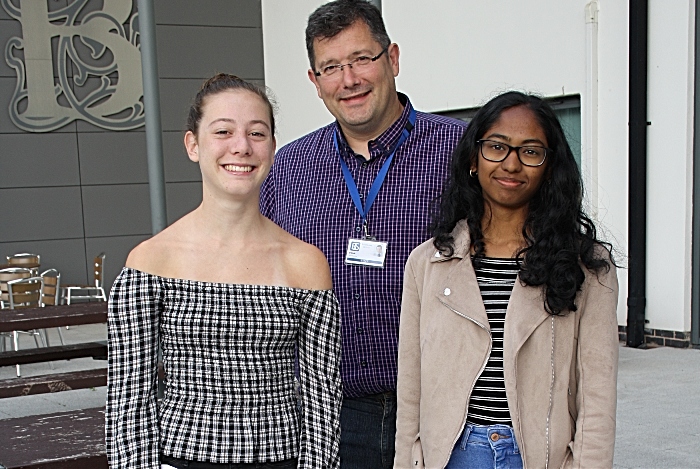 Headteacher David Cole with Freya Davies and Sharmila Thirumurugan