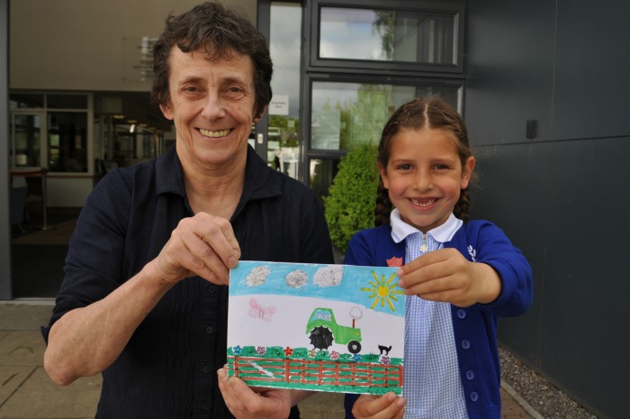 Helen Kay, team leader HEST, with Naomi Dean and winning postcard drawing