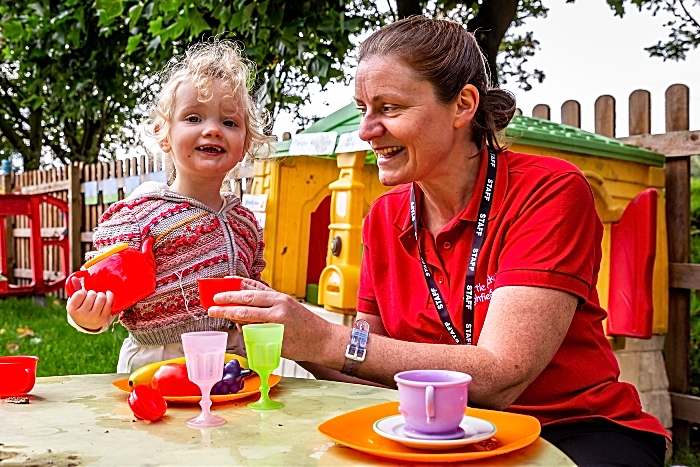 Highfield Academy - It’s teatime with toddler Nancy Wise in the outdoor play kitchen
