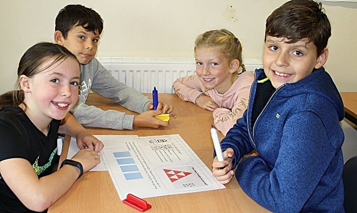 Isobel Jones, George Jackson, Lucy Tonkin and Louis Dore put their heads together to solve a maths puzzle