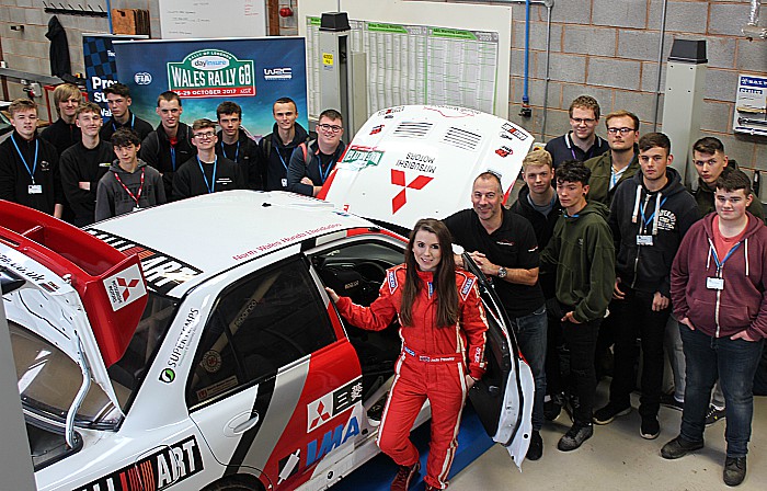 Jade Paveley rally car and students wide shot