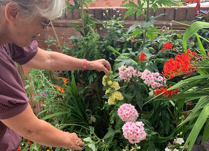 Jenny Brown tending to flowers
