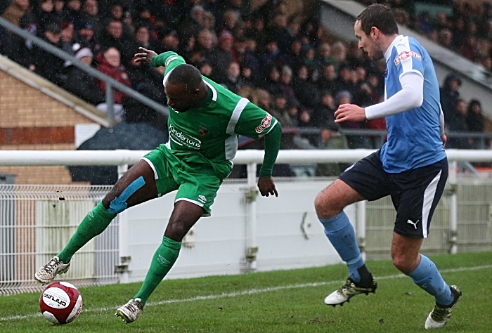 Joe Mwasile controls the ball under pressure from South Shields in the rain at the Weaver Stadium (1)