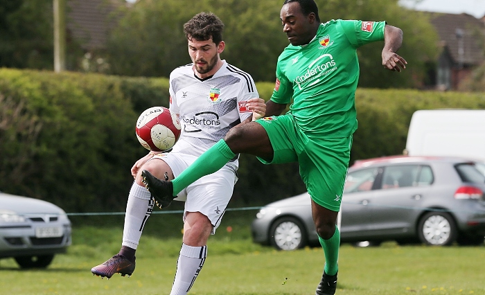 White Star v Nantwich - Joe Mwasile (green strip) rises to the ball (1)