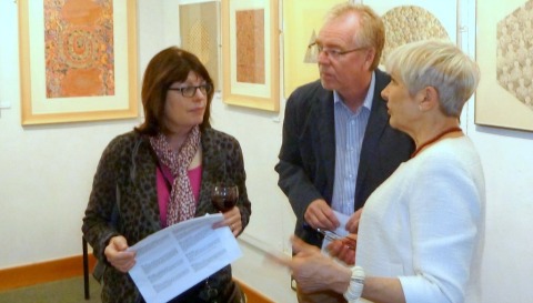 Kate McKennan (right) discussing her work