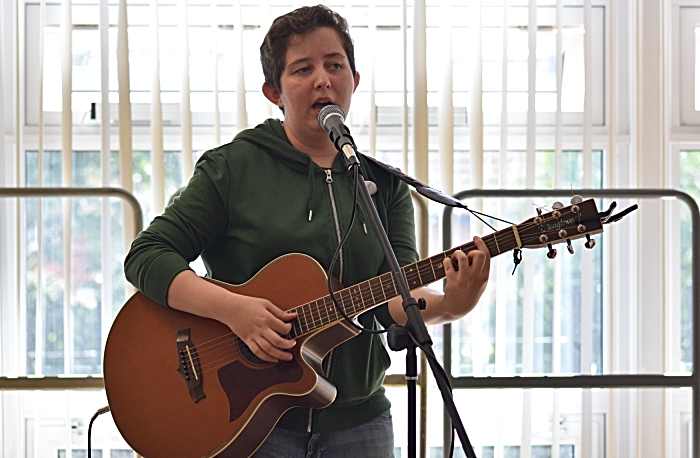 Laura Cunliffe sings and plays guitar in the school hall (1)