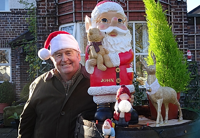 Laurence Perry with some of his Christmas themed gnomes and collectables
