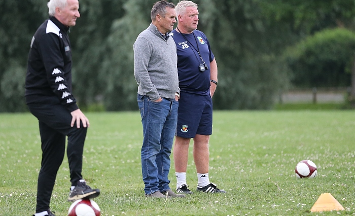 Members of the Management team oversee a practice match (1)