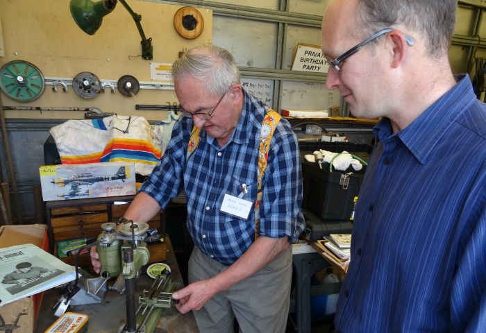 Mike Smith gives a demonstration to visitor Christopher White