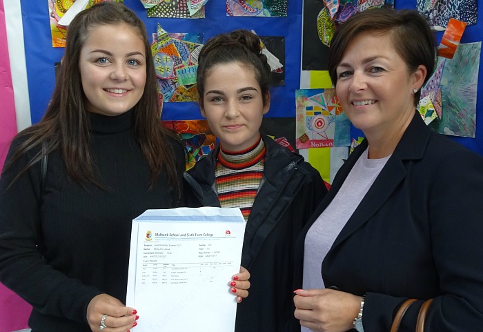 Molly Ann Jones celebrating her A Level success with her sister and her mum at Malbank