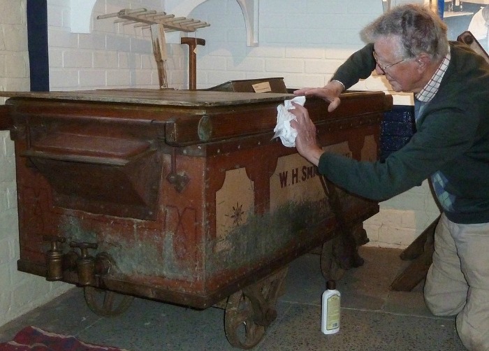 Museum volunteer Brian Moore restoring the cheese vat