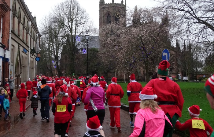 Nantwich Santa Dash with St Marys Church in the background