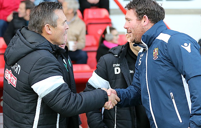 Nantwich manager Dave Cooke shakes hands before the game with Stevenage manager Darren Sarll