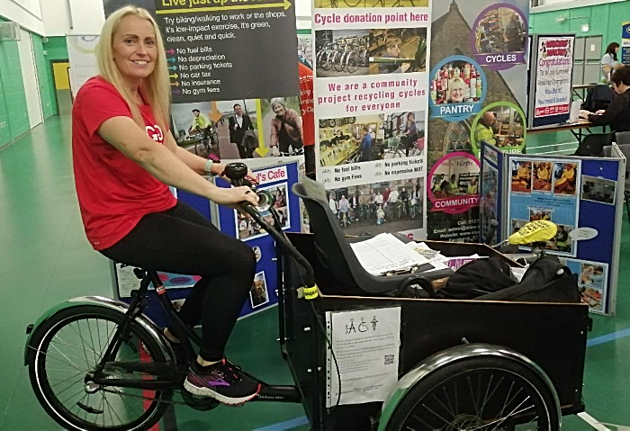 Nicola Marshall from GoodGym in Crewe tries out the cargo bicycle whilst it was on display at Crewe Lifestyle Centre