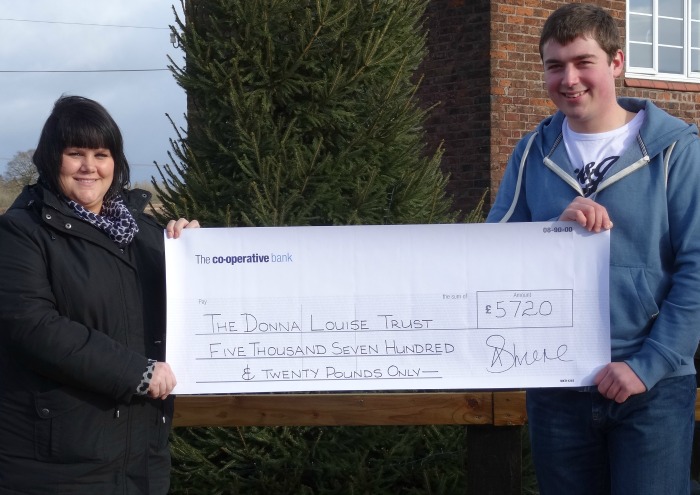Nikki Wrench from The Donna Louise Childrens Hospice receives the cheque from Graham Witter