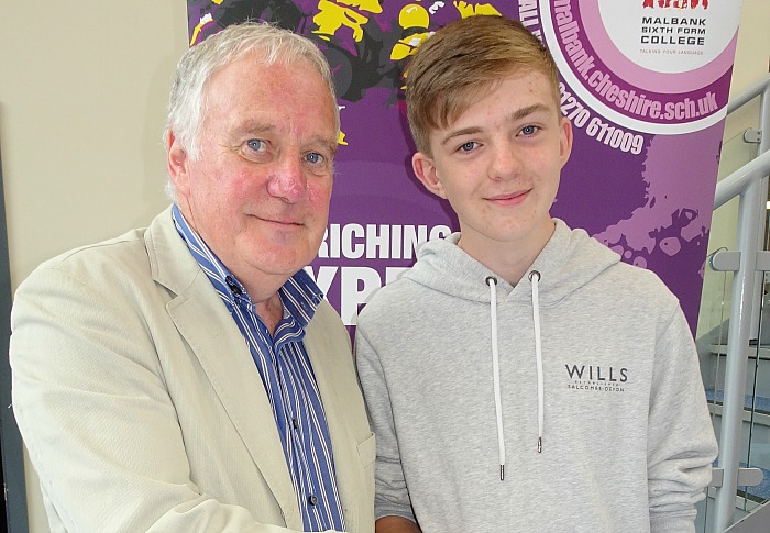 Oliver O'Hara who is being congratulated on his grades by Chair of Governors, Mr Geoff Watts