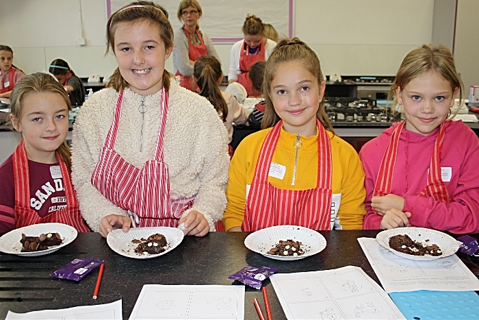 Olivia Spender, Sophie Hodgkiss, Willow Michelmore and Emily Leach proudly show their finished chocolate creatures