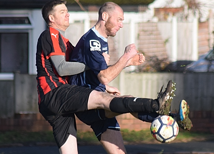 Players challenge for the ball (1)