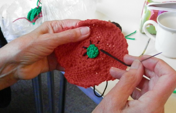 Knitted poppies project by Crewe and Nantwich Seniors Forum