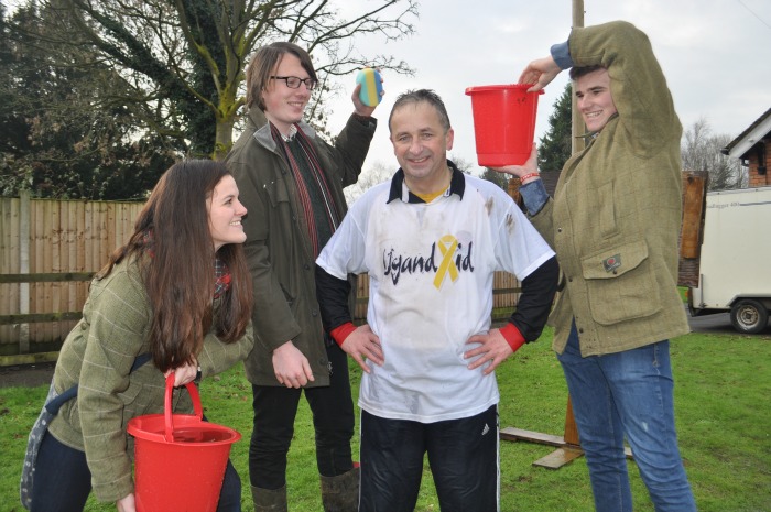 Raising money for Africa - Preparing for a soaking mark Walton with students Sam Gibbons, Alex Hutson and Matt Dudley