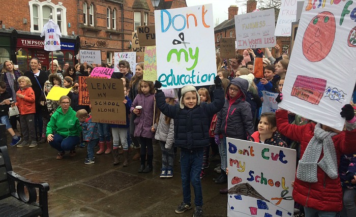 Protesting in nantwich town square, school funding cuts, timpson shop in background