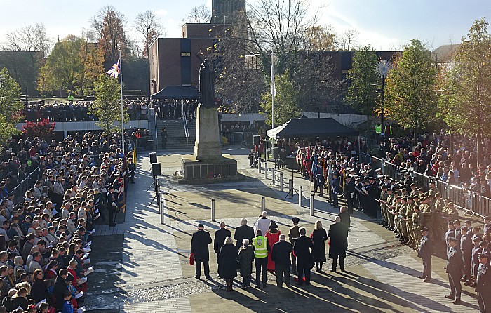 Reverend Ken Sambrook leads the service on Memorial Square