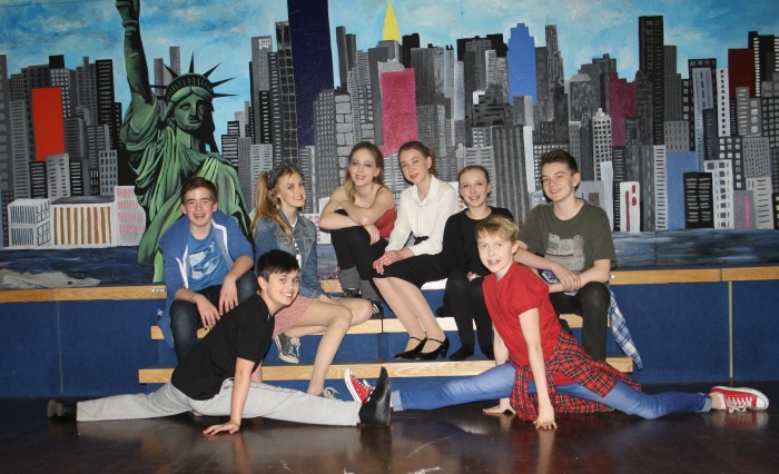 Fame - Rory Godden, Emily Inskip, Ellen Wynn, Grace Latham, Jasmine Tomlinson and Adam Boulton sit on stage to watch Harry Grigg and Jack Bacon practising the splits