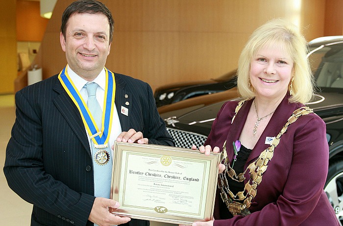 Rotary Club of Bentley Cheshire President Carlos Costa is presented with the official Charter by President of Rotary International Great Britain and Ireland, Eve Conway