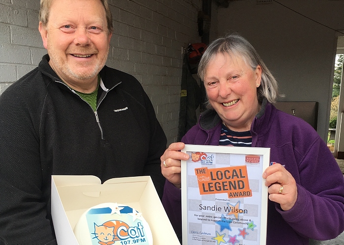 Sandie Wilson is pictured with her Cat Cake and Local Legend award certificate with her husband Mark (1)