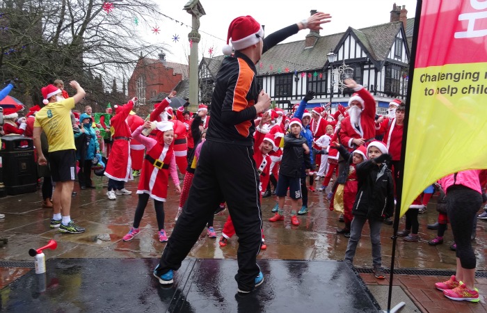 Santa Dash - Instructor from Everybody provides a pre-race warmup