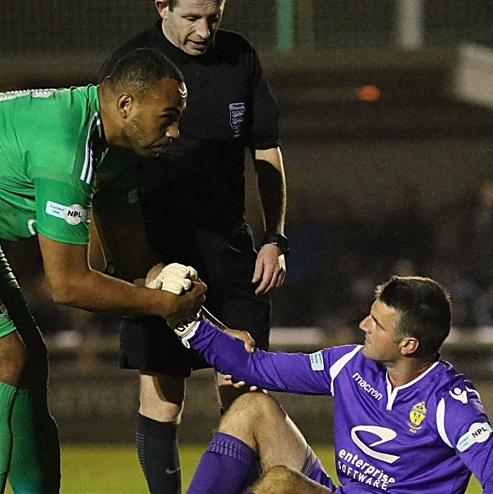 Second-half - Clayton Mcdonald sportingly helps up Warrington keeper Anthony McMillan (1)