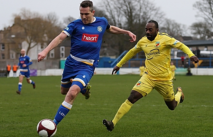 Second-half - Joe Mwasile puts pressure on Lancaster City captain Glenn Steel (1)