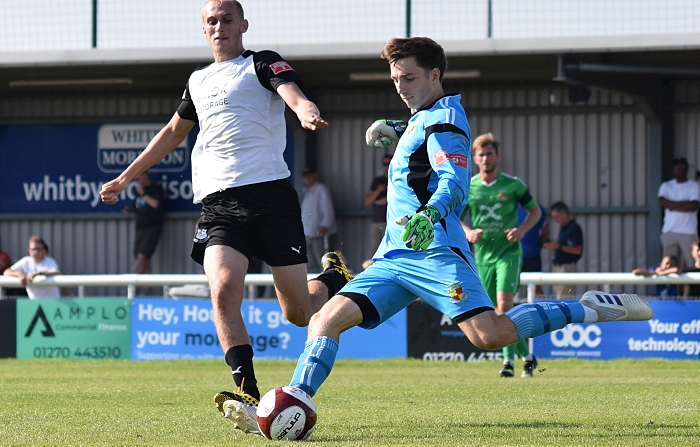 Second-half - Nantwich keeper Cameron Terry clears under pressure from Ewan Bange (1)